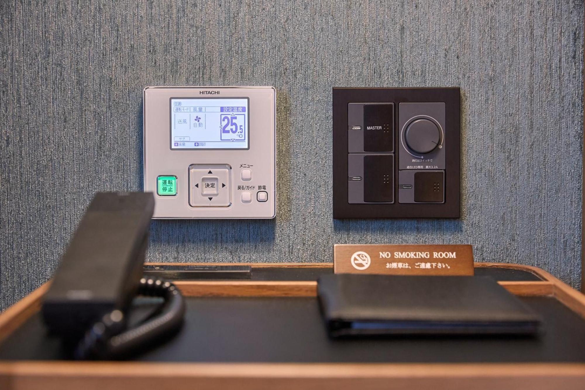 Hotel Collective Naha Exterior photo A Siemens room controller